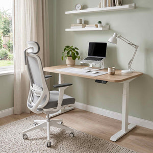 Home office setup with a desk, chair, laptop, and decor.