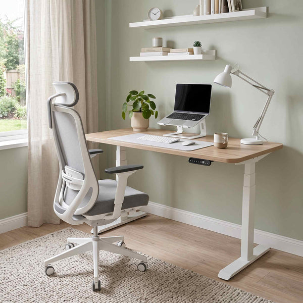 Home office setup with a desk, chair, laptop, and decor.
