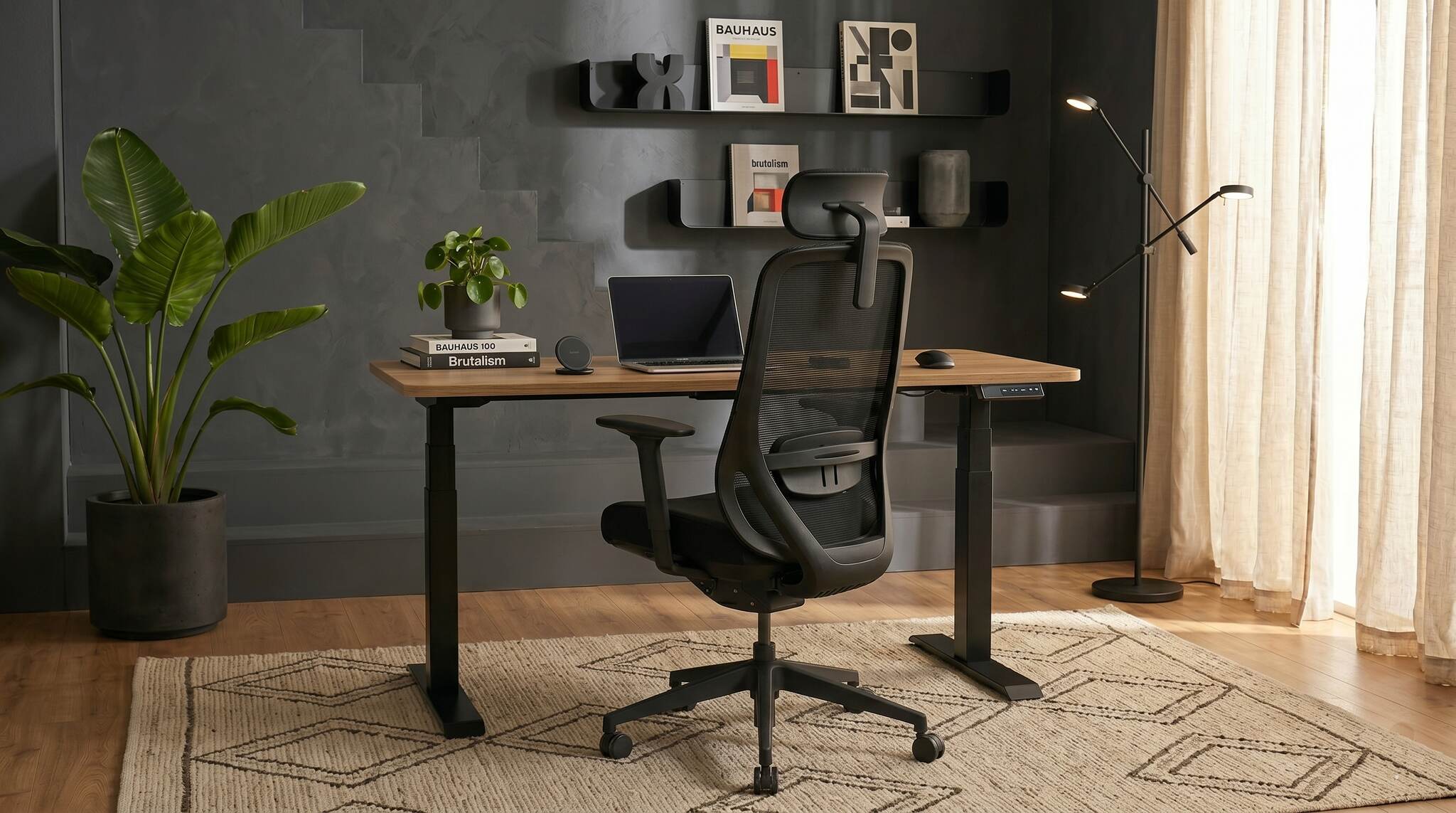 Modern office setup with a stand-up desk, chair, and decor elements.