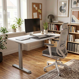 Modern home office with a desk, chair, and computer setup.