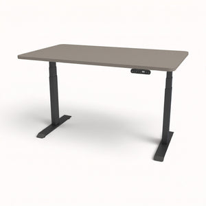 An adjustable height standing desk with a gray top and black metal legs, featuring a small control panel under the right side of the tabletop.