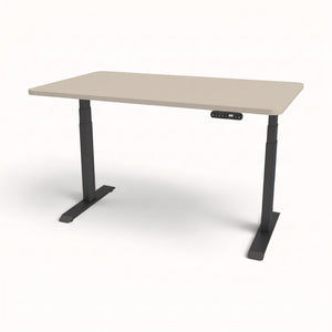 An adjustable standing desk with a light beige rectangular tabletop and dark gray metal legs, shown on a clean white background.