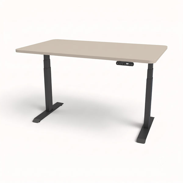 An adjustable standing desk with a light beige rectangular tabletop and dark gray metal legs, shown on a clean white background.