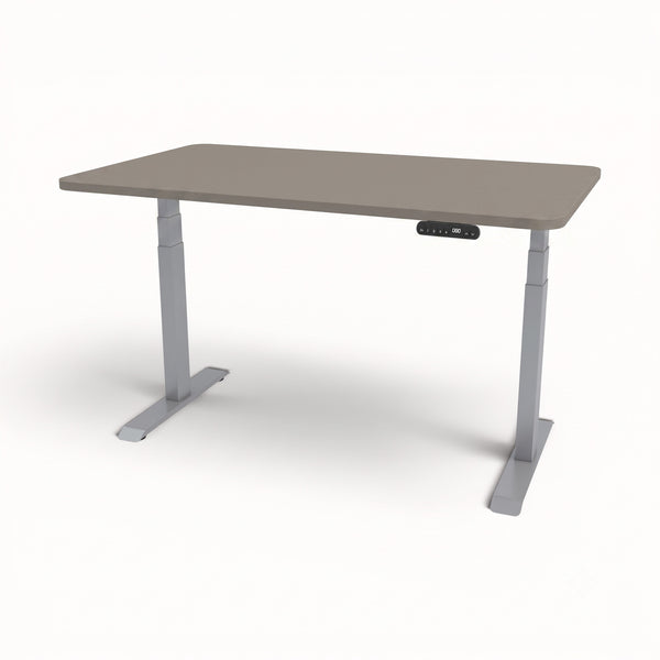 An adjustable height standing desk with a taupe-gray rectangular desktop and light gray metal legs, featuring a small digital control panel on the front right side.