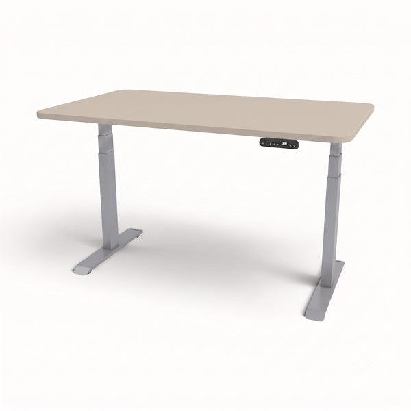 An adjustable height standing desk with a light beige rectangular tabletop and gray metal legs, featuring a small black control panel on the front right side.
