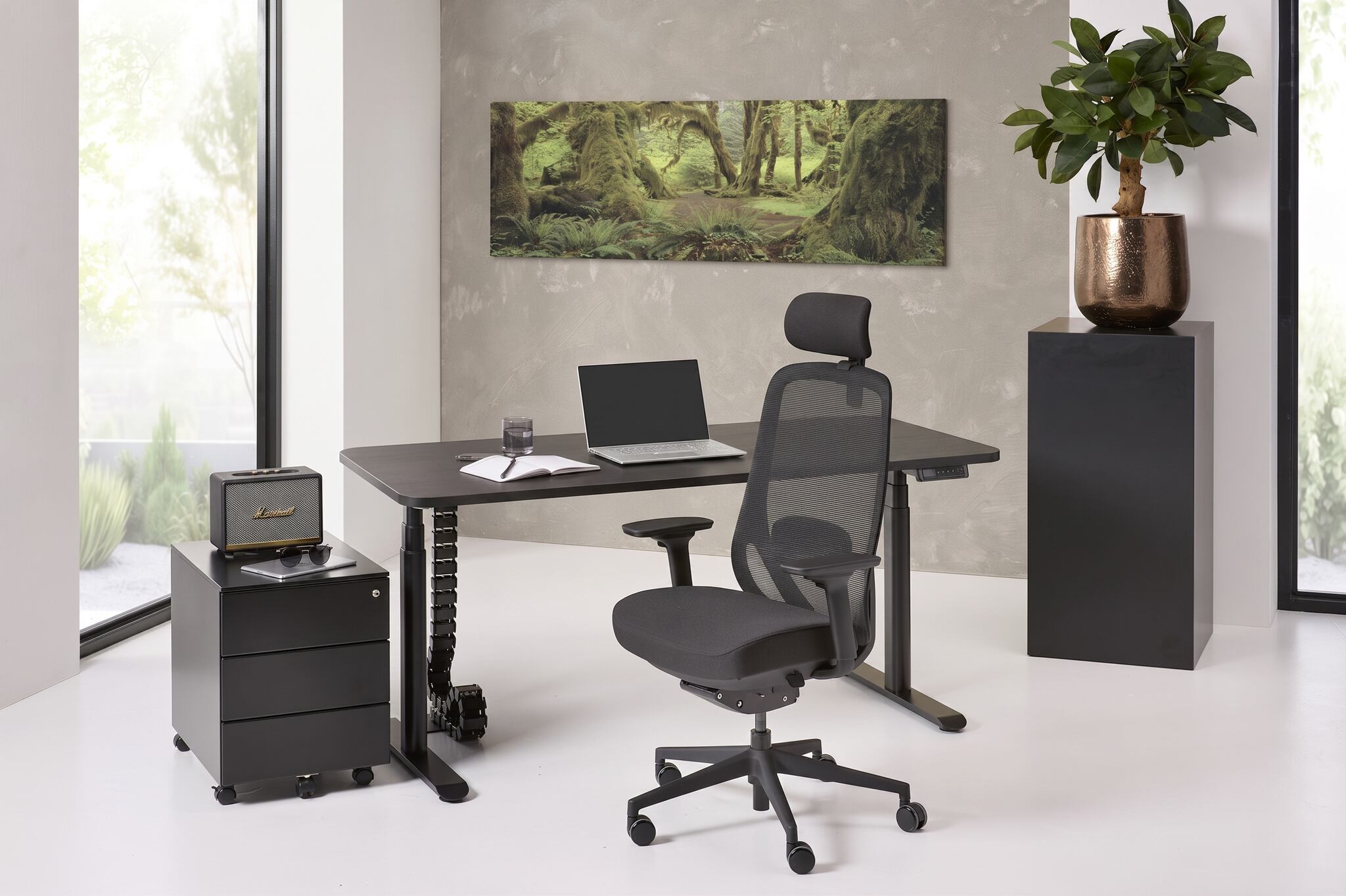 Modern office setup with a desk, chair, and computer in a bright room.